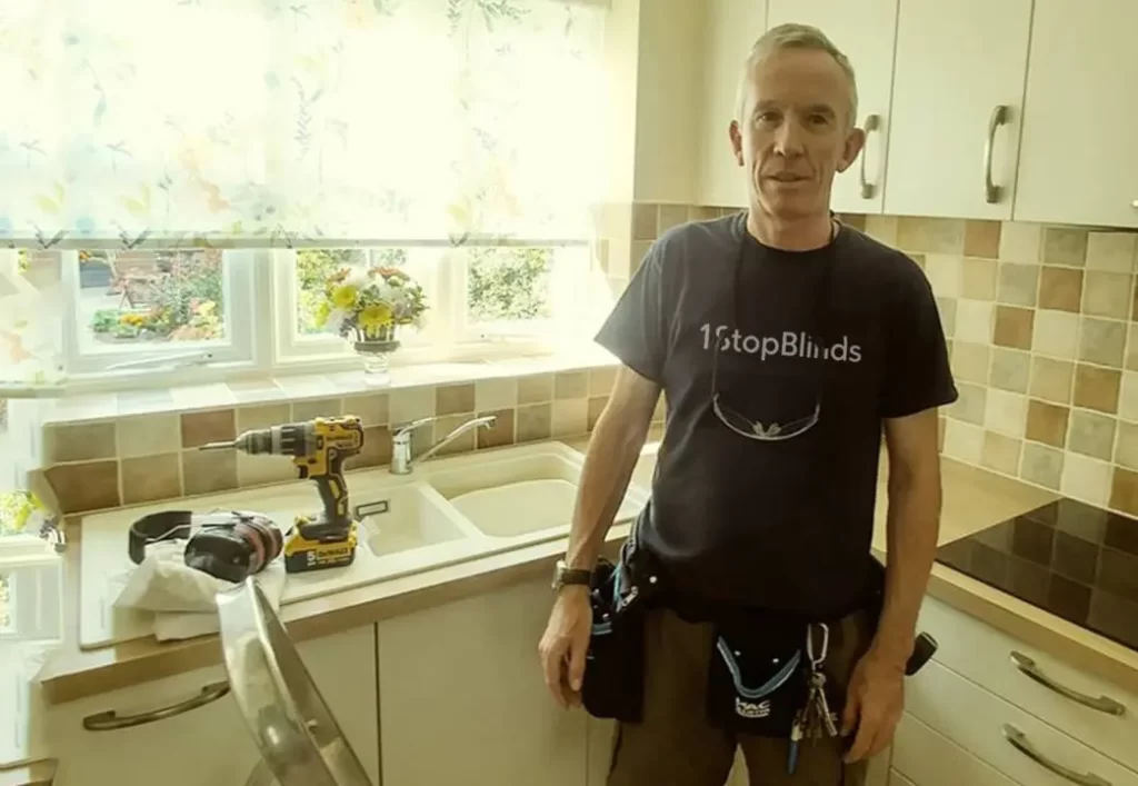 Paul McGilligan fitting blinds in a customer's home